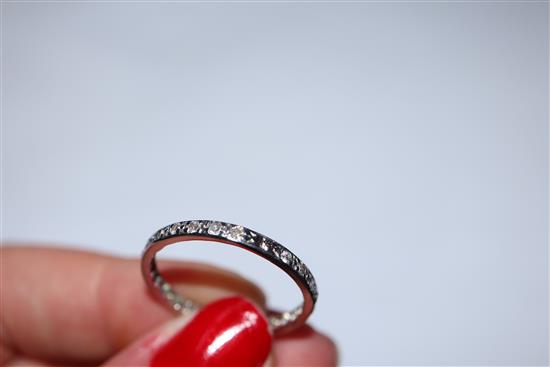 A white metal and diamond set full eternity ring, size R.